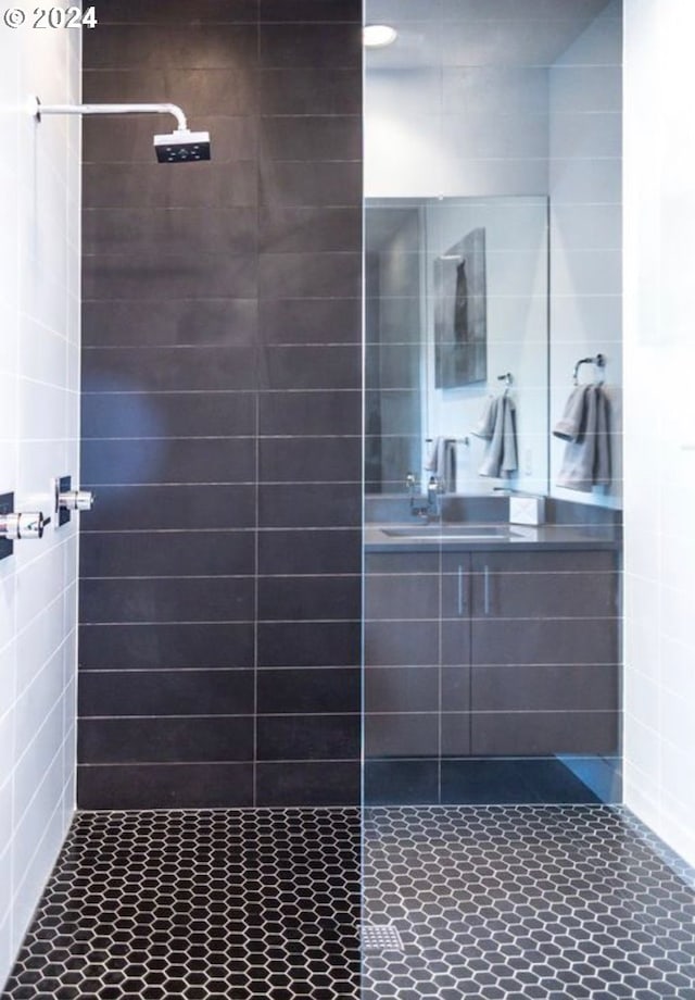 bathroom with tiled shower