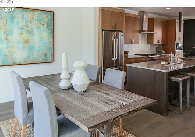 dining space with dark wood-type flooring and sink