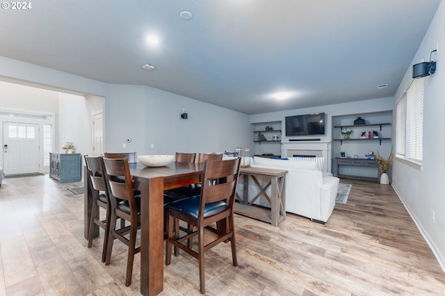 dining space featuring light hardwood / wood-style floors and plenty of natural light