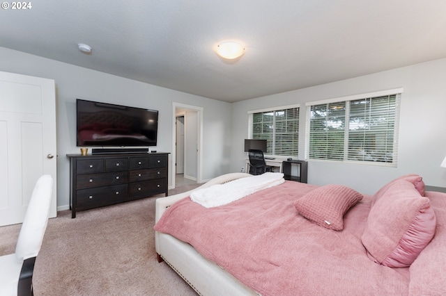 bedroom featuring light colored carpet