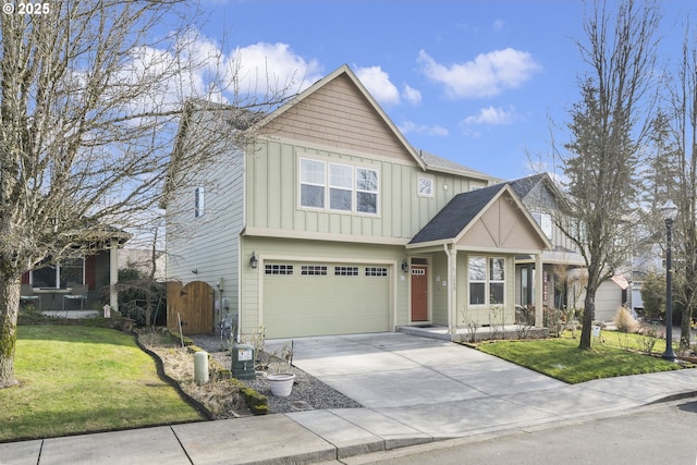 view of front of house with a garage and a front yard