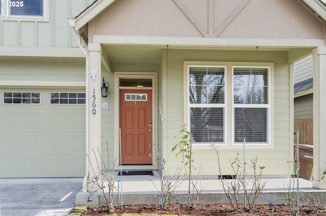 view of exterior entry with a garage