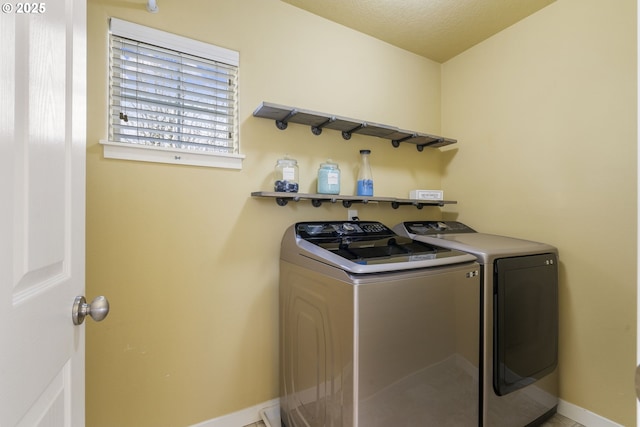 washroom with separate washer and dryer