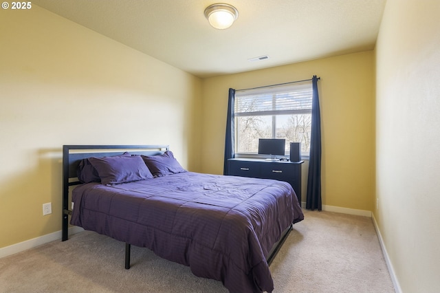 bedroom featuring light carpet