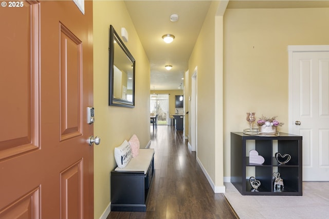 corridor with dark wood-type flooring