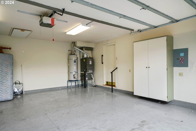 garage with water heater and a garage door opener