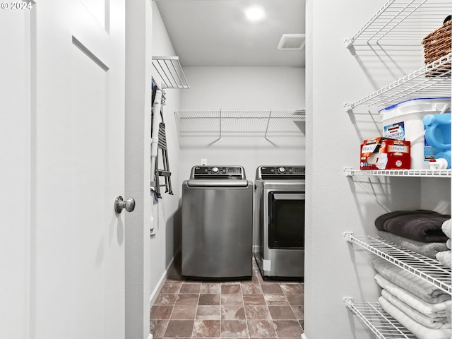 washroom featuring independent washer and dryer