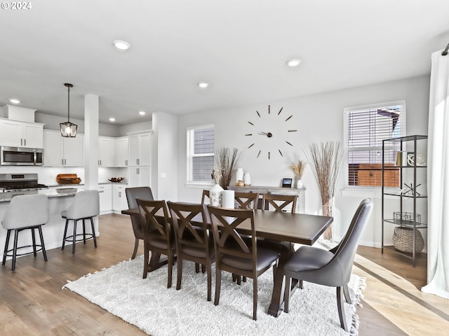 dining area with wood-type flooring