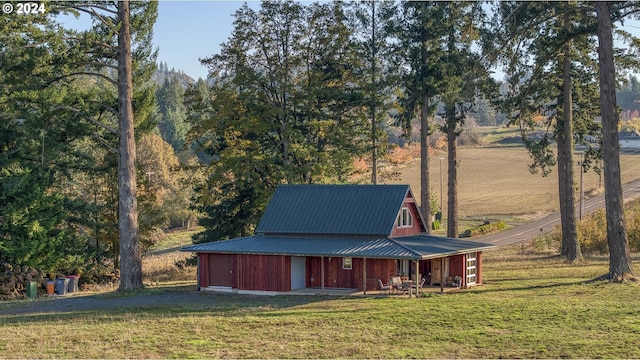 exterior space with a lawn and a rural view