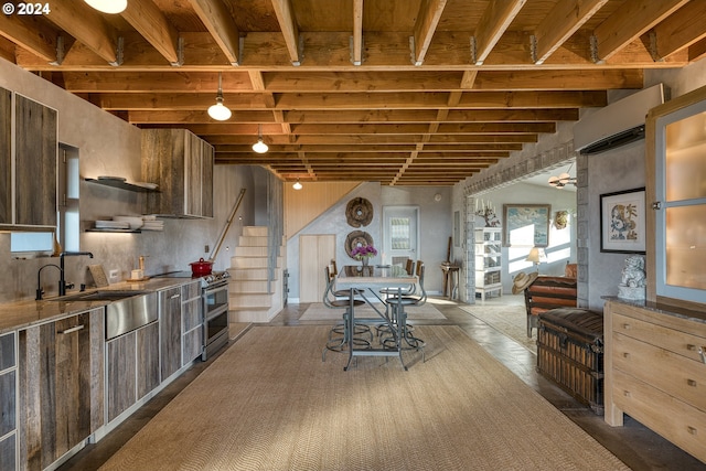 6850 SE Eola Hills Rd, Amity, OR 97101 - kitchen featuring range with two ovens, a sink, modern cabinets, beamed ceiling, and a wall mounted AC
