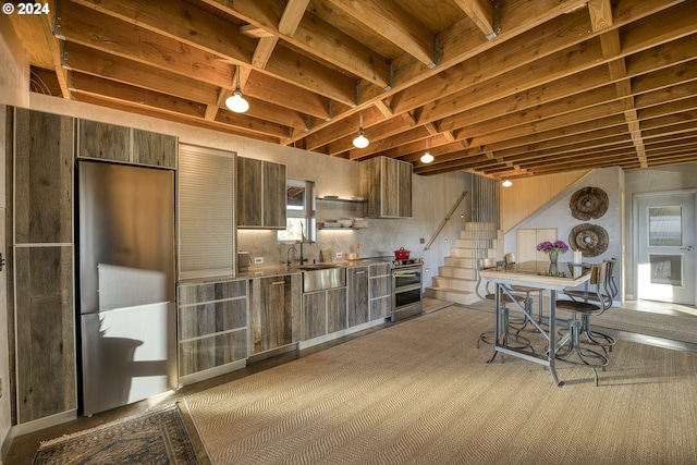 kitchen featuring backsplash, sink, and stainless steel appliances