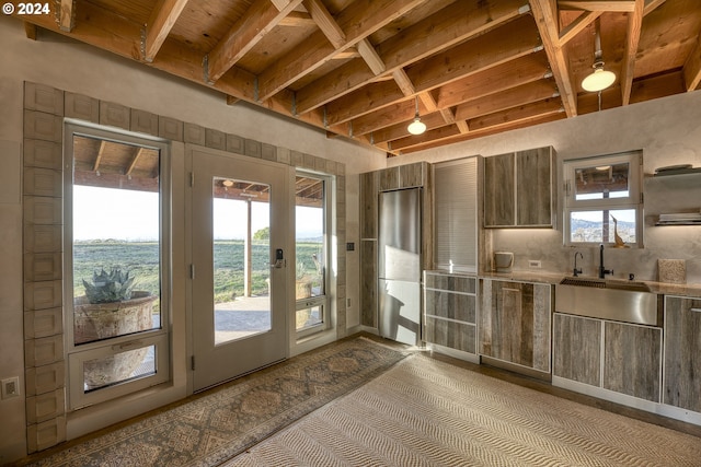 6850 SE Eola Hills Rd, Amity, OR 97101 - kitchen with plenty of natural light, light countertops, a sink, backsplash, and wood ceiling with exposed beams