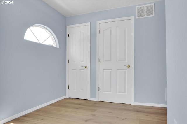 foyer entrance featuring light hardwood / wood-style flooring