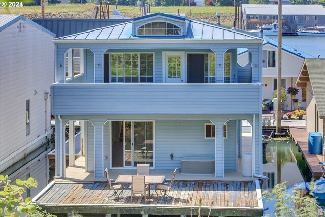 rear view of property with a deck