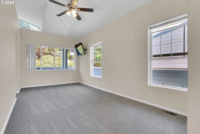 spare room featuring carpet, high vaulted ceiling, and ceiling fan