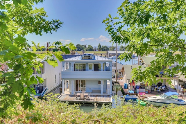 back of house featuring a deck