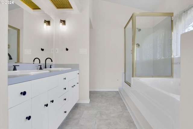 bathroom featuring a shower with door and vanity