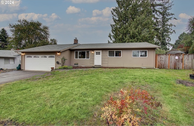 single story home with a garage and a front yard