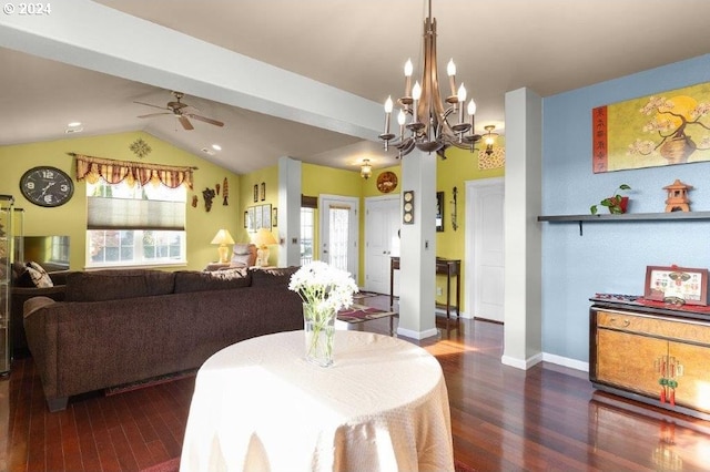 dining space with ceiling fan with notable chandelier, vaulted ceiling with beams, and dark wood-type flooring