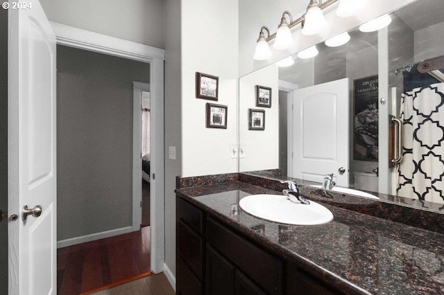 bathroom featuring wood-type flooring and vanity