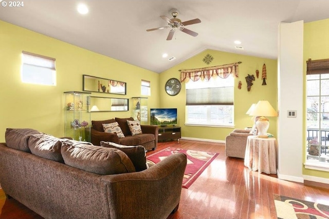 living room with hardwood / wood-style floors, ceiling fan, and lofted ceiling