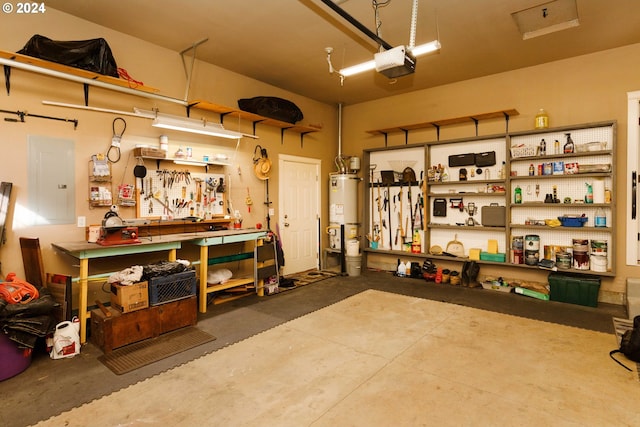 garage featuring a workshop area, a garage door opener, and water heater