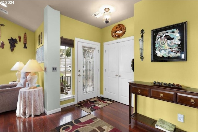 entryway with dark hardwood / wood-style flooring