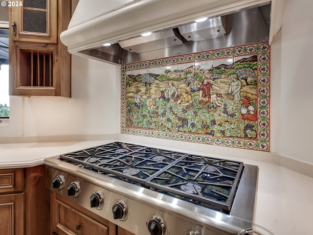 kitchen featuring stainless steel gas cooktop and custom range hood