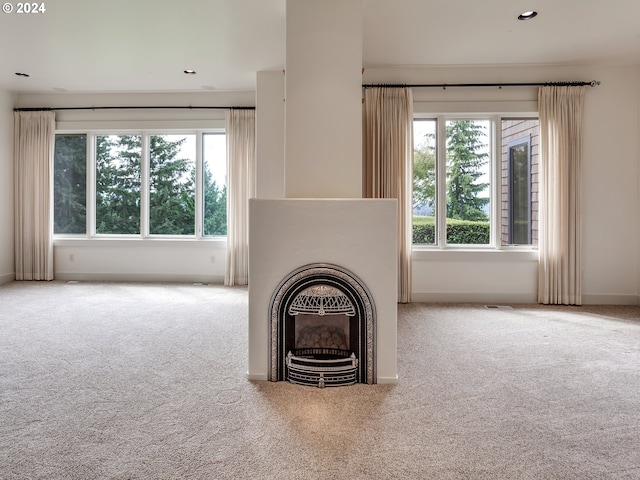 unfurnished living room with carpet flooring