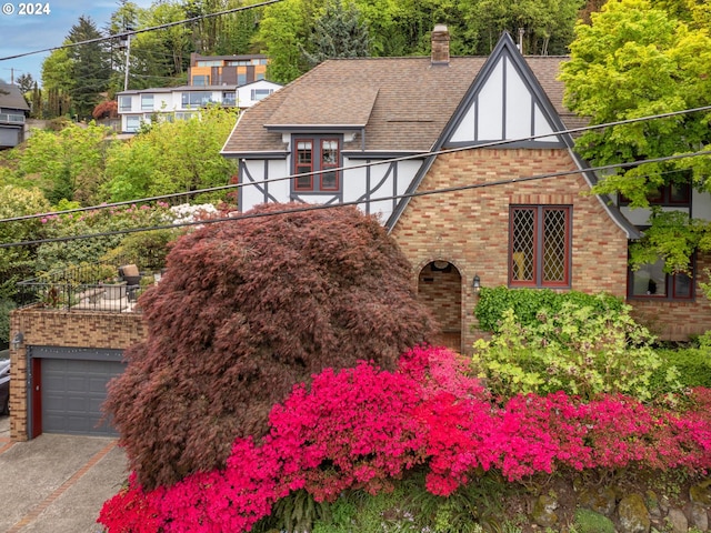 tudor home featuring a garage