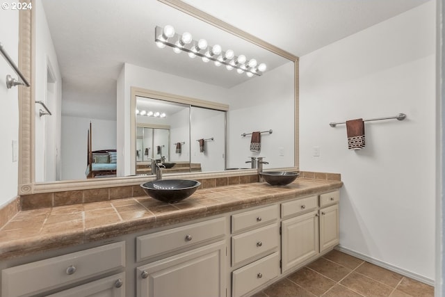 bathroom featuring tile patterned floors and vanity