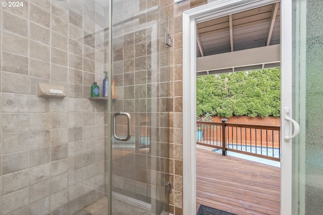 bathroom with a shower with shower door