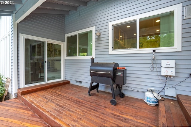 wooden deck with grilling area