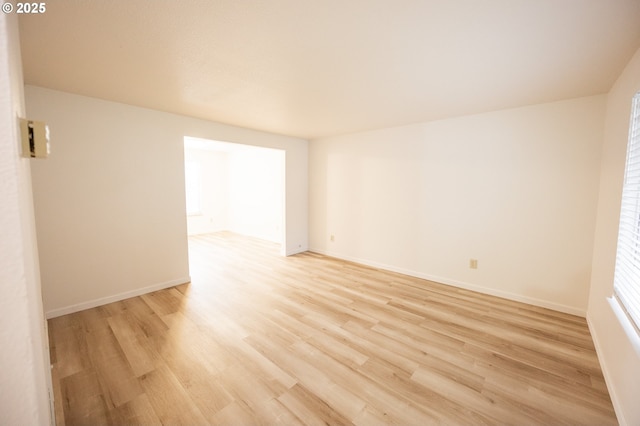 spare room with light hardwood / wood-style floors