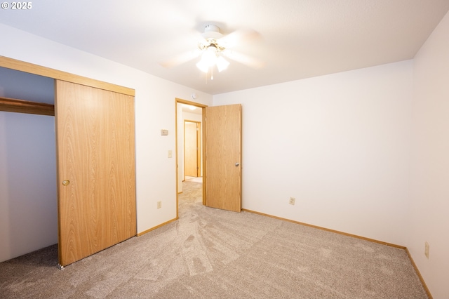 unfurnished bedroom with carpet flooring, a closet, and ceiling fan