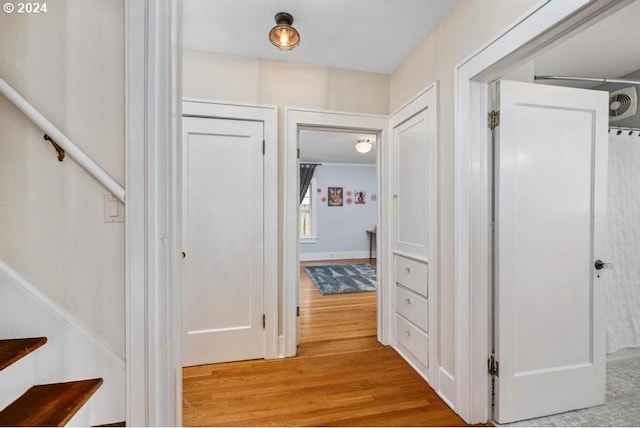 corridor featuring light hardwood / wood-style floors