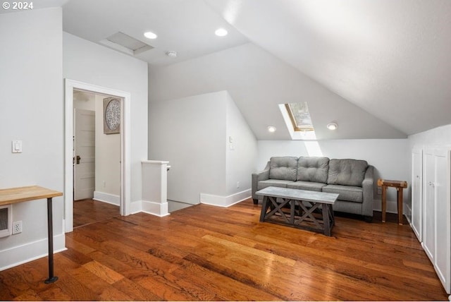 interior space featuring dark wood-type flooring and lofted ceiling