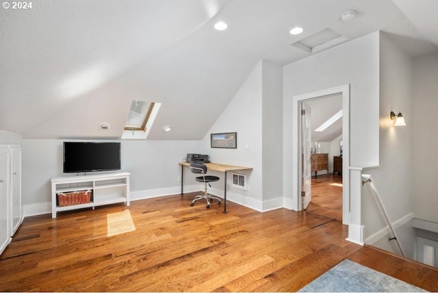 office area featuring hardwood / wood-style flooring and lofted ceiling