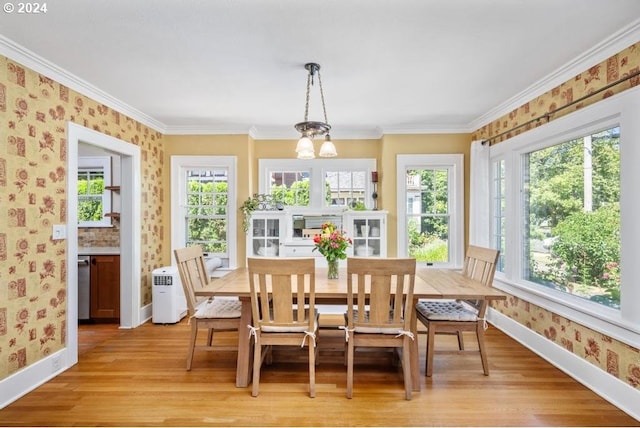 sunroom / solarium with a chandelier