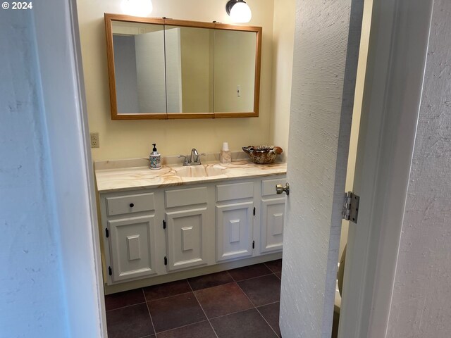 bathroom featuring vanity and tile patterned flooring