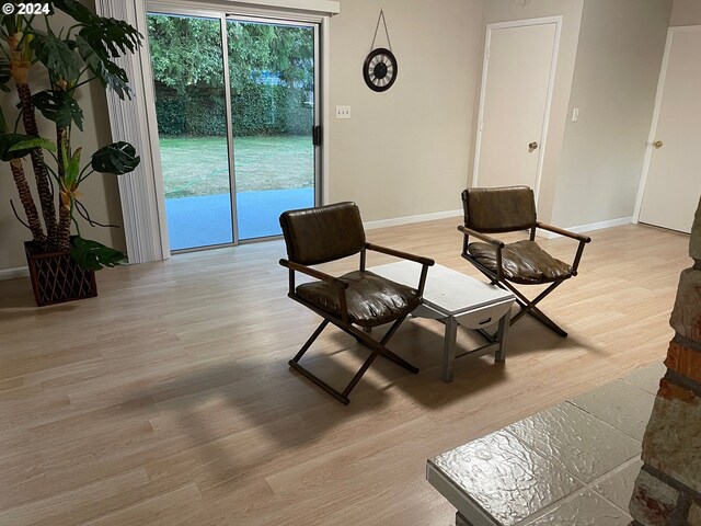 sitting room with light hardwood / wood-style flooring