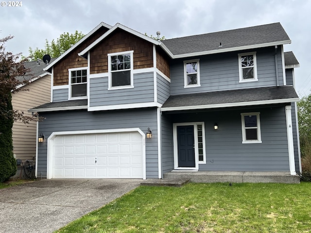 view of front of home featuring a garage and a front yard