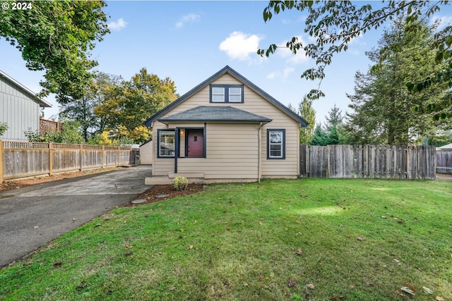 bungalow-style home featuring a front yard