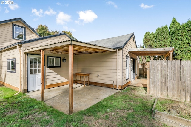 rear view of property featuring a patio area