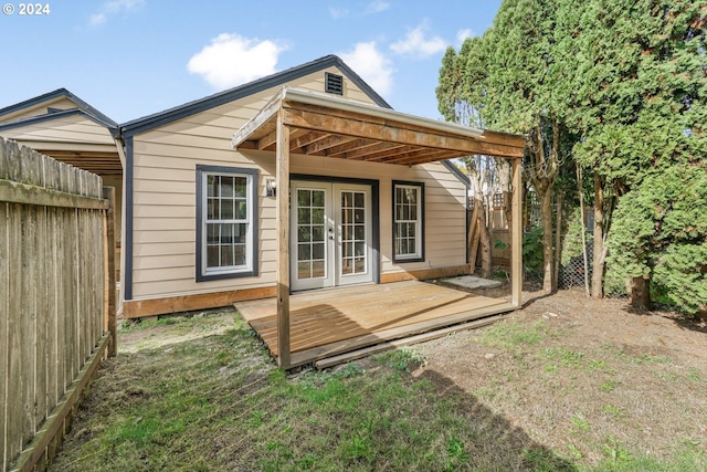 rear view of house with french doors and a deck