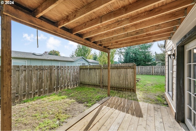 wooden terrace with a lawn