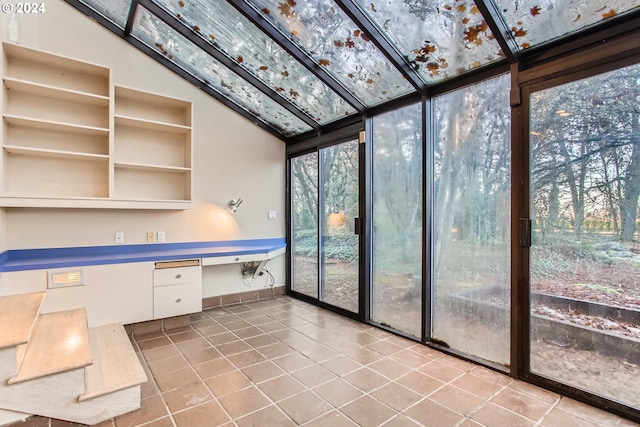 unfurnished sunroom with lofted ceiling