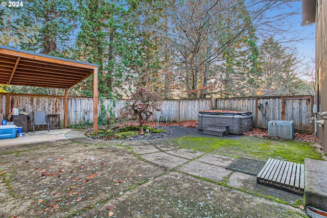 view of yard with a patio and central AC