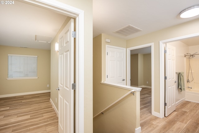 corridor featuring light hardwood / wood-style floors