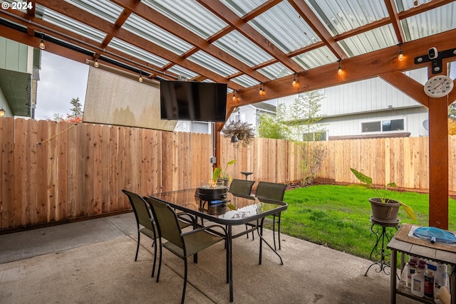 view of patio featuring outdoor dining space, a pergola, and a fenced backyard